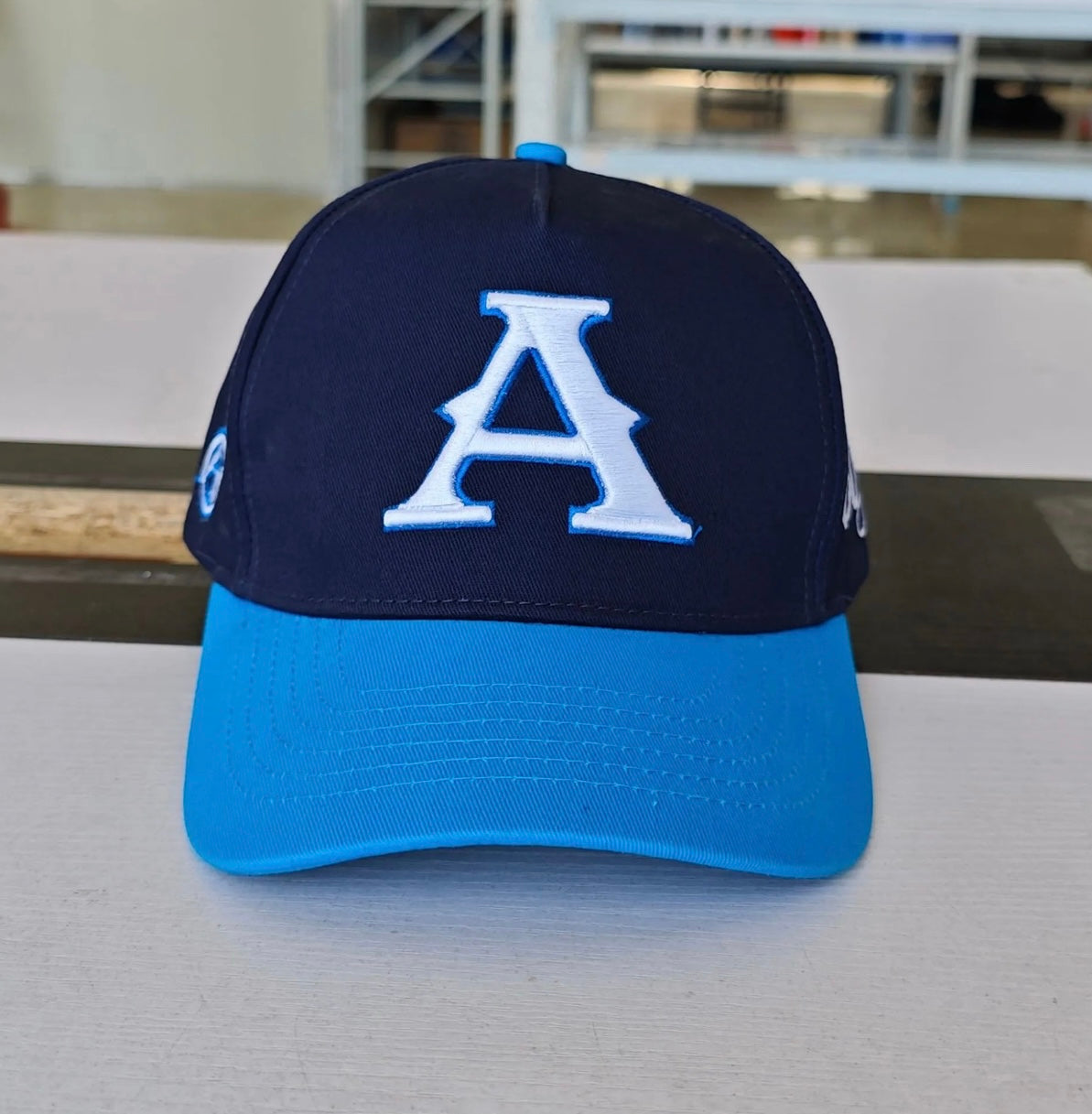 Navy SnapBack ‘Against’ Hat